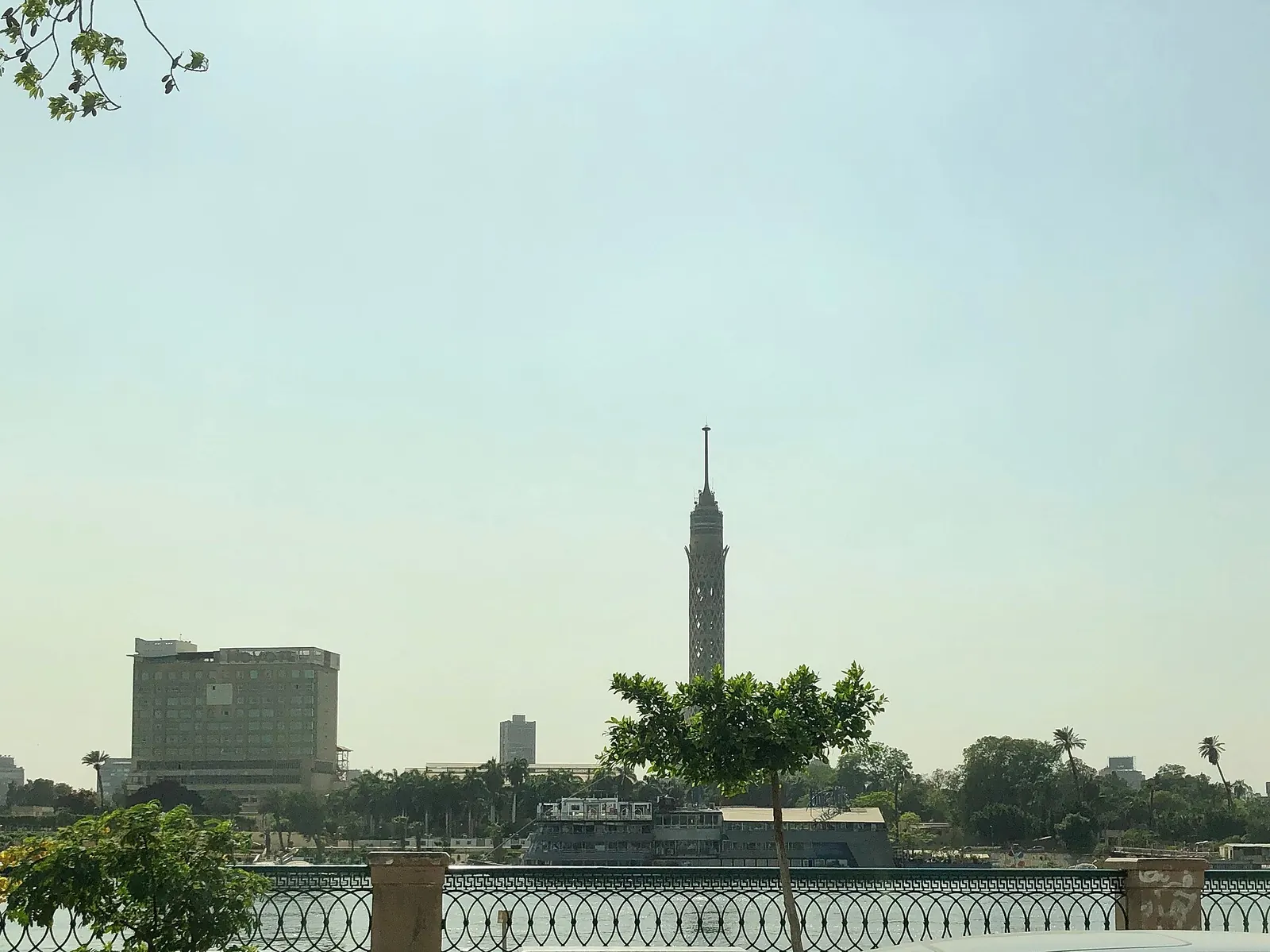 Cairo Tower seen across the Nile from the Corniche on a hazy morning